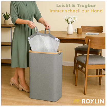 Frau öffnet den Deckel des Roxlin Wäschekorbs 100L mit herausnehmbarer Tasche