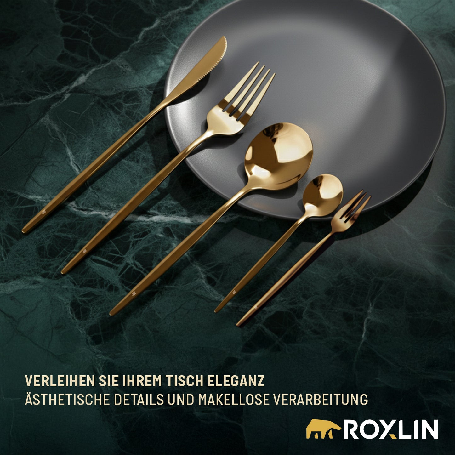 Roxlin Edelstahl-Besteckset in Gold auf dunklem Teller elegant angerichtet