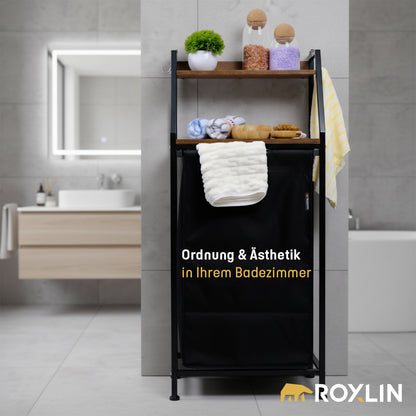 Roxlin Wäschekorb mit Regal und Handtuchhalter neben dem Waschbecken im Bad